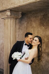 couple smiling in wedding photos after getting porcelain veneers in Las Vegas